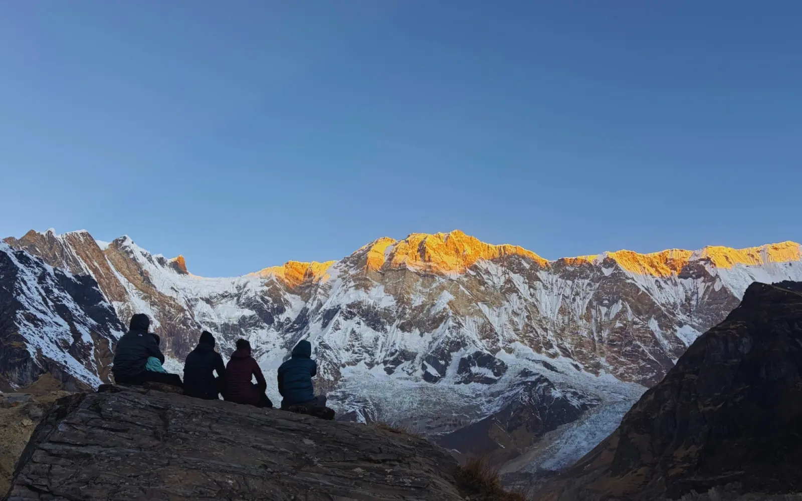 Trekkers watching the sunrise at annapurna base camp Trek