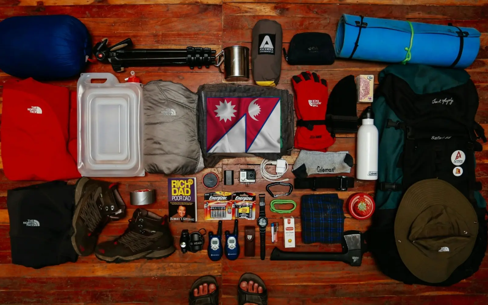 Complete packing list for trekking in Nepal showing trekker with backpack and layered clothing on Himalayan trail
