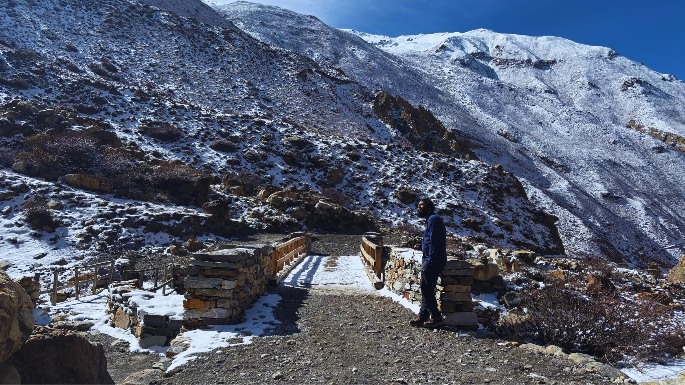 experienced trekking guide heading toward Kang La Pass location on a high-altitude trail in the Himalayas