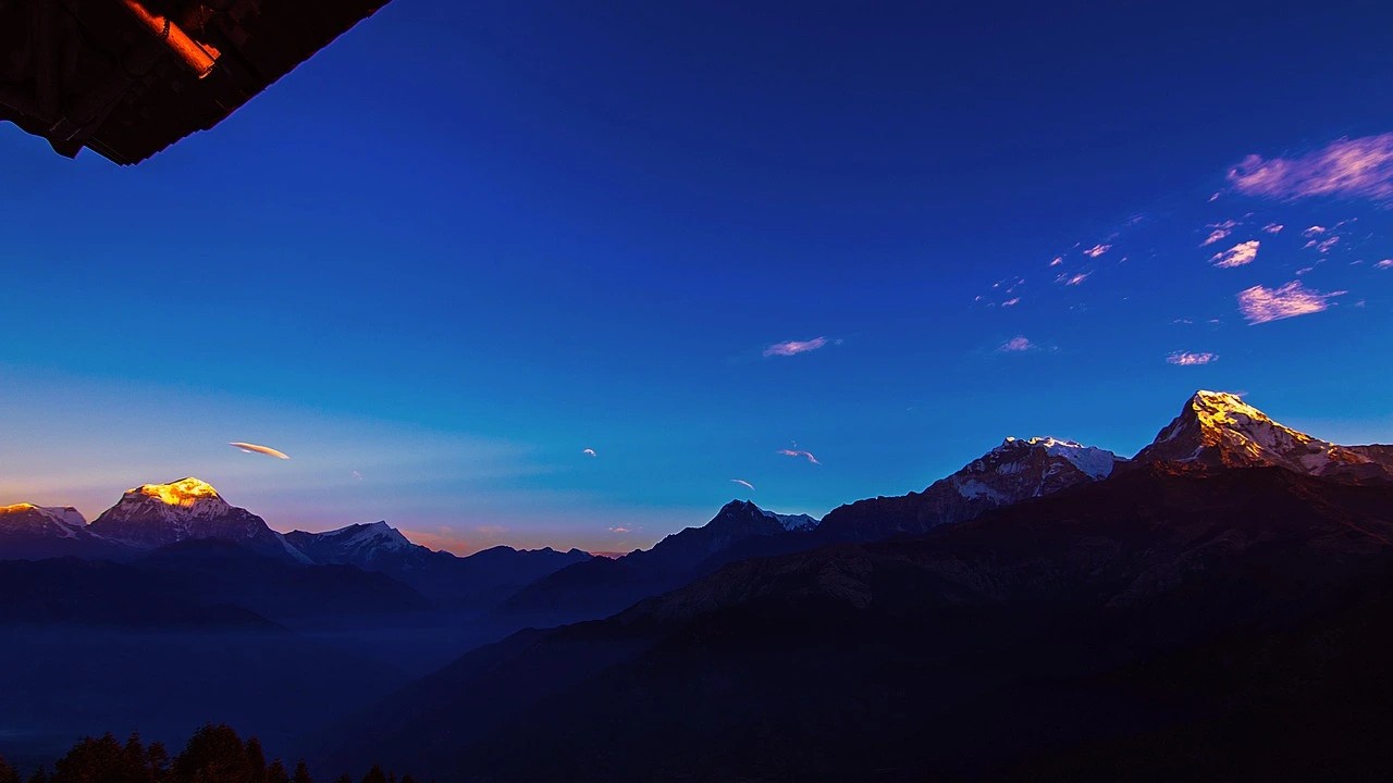 Panoramic view of the Annapurna Range and Dhaulagiri seen from a hotel balcony in Ghorepani during the Annapurna Base Camp Trek.