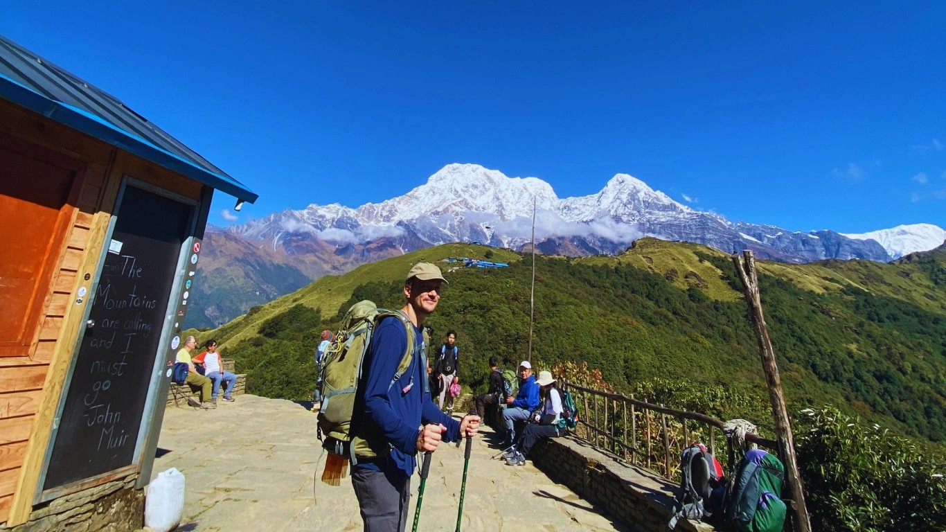 Trekkers posing on the way to High Camp with the Annapurna mountain ranges in the background