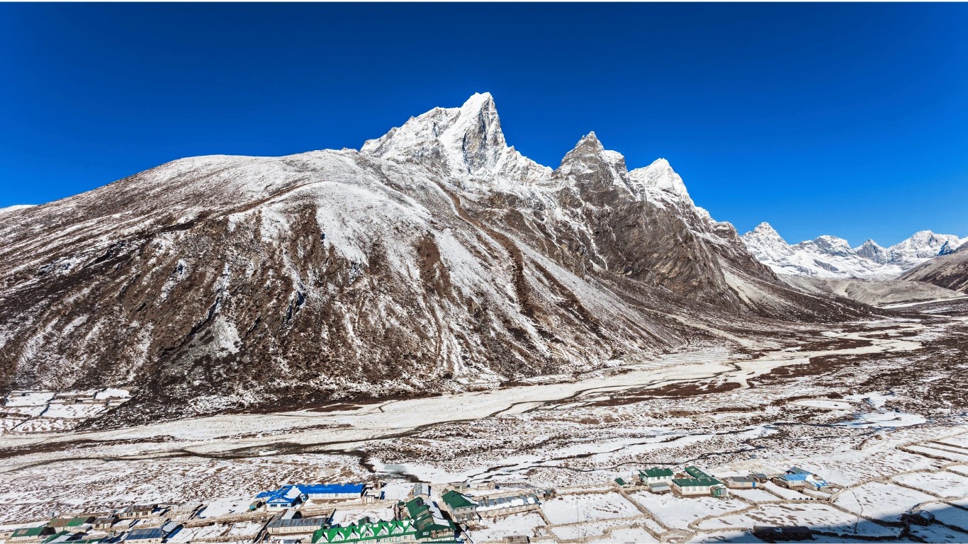 Aerial view of Dingboche village covered in light snow during the Everest Base Camp Trek in Nepal.