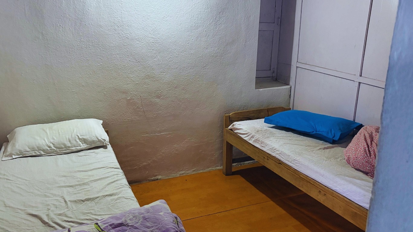 Simple twin-bed teahouse room in Lower Dovan along the Annapurna Base Camp Trek.