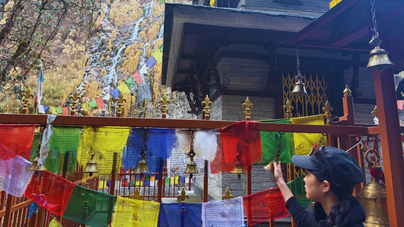 International trekkers praying at Pojenhyam Temple sacred Shakti Pitha on ABC trail