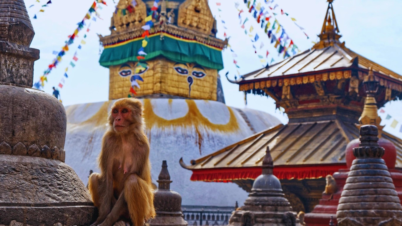 Swayambhunath Stupa in Kathmandu Nepal also known as Monkey Temple with prayer flags and panoramic valley view.