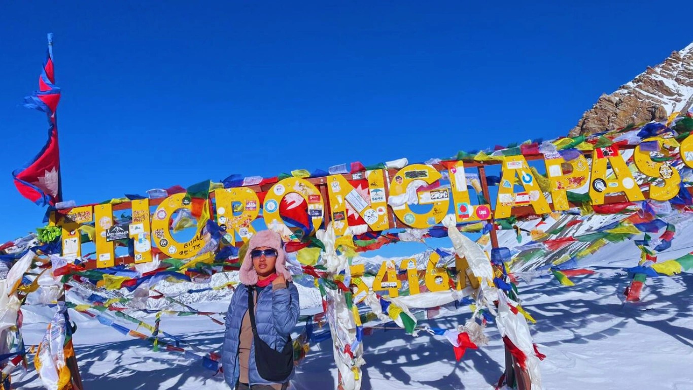 Female trekking guide at top of thorang la pass