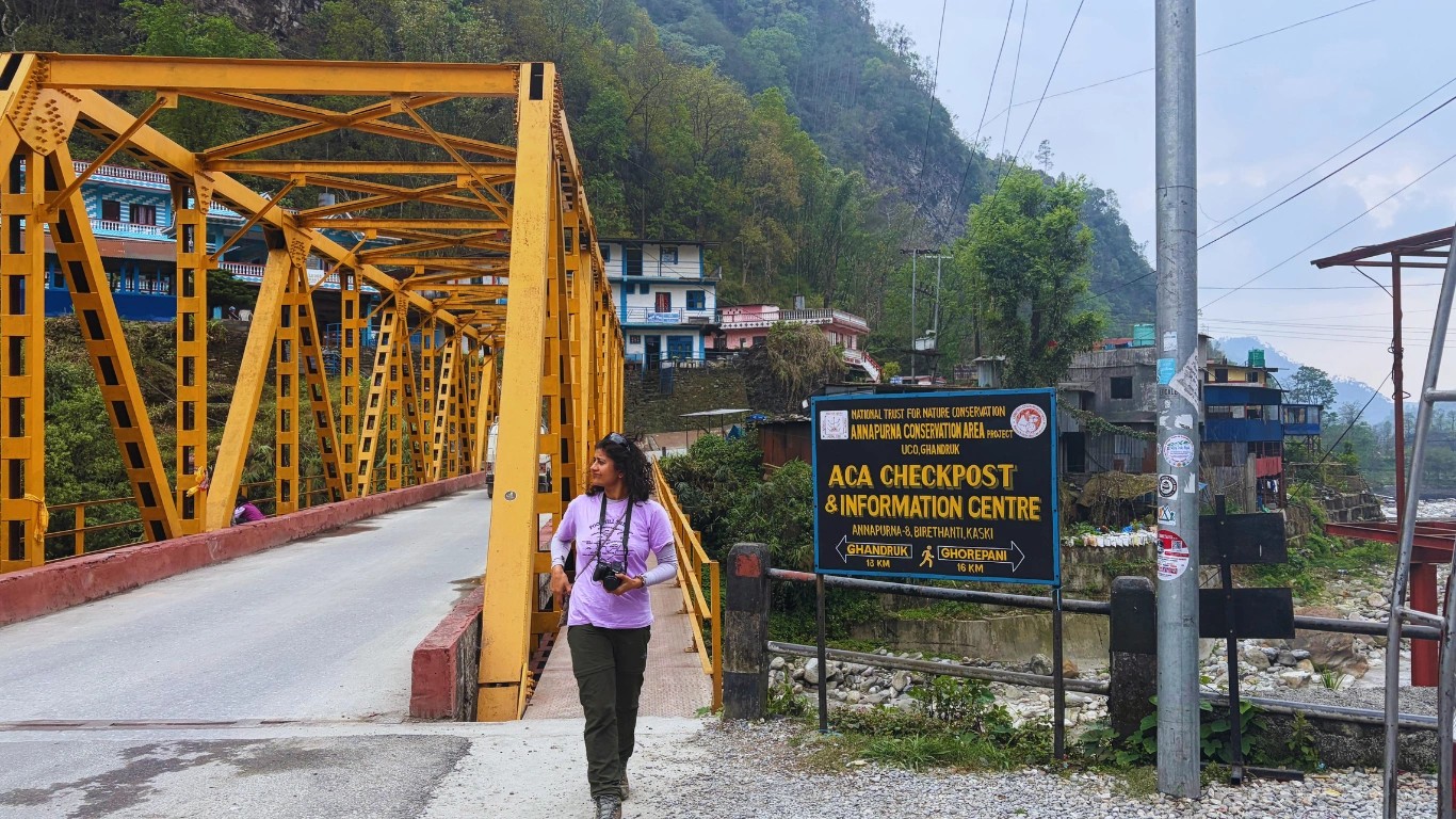 Happy trekkers at Annapurna Circuit ACAP checkpoint and information board