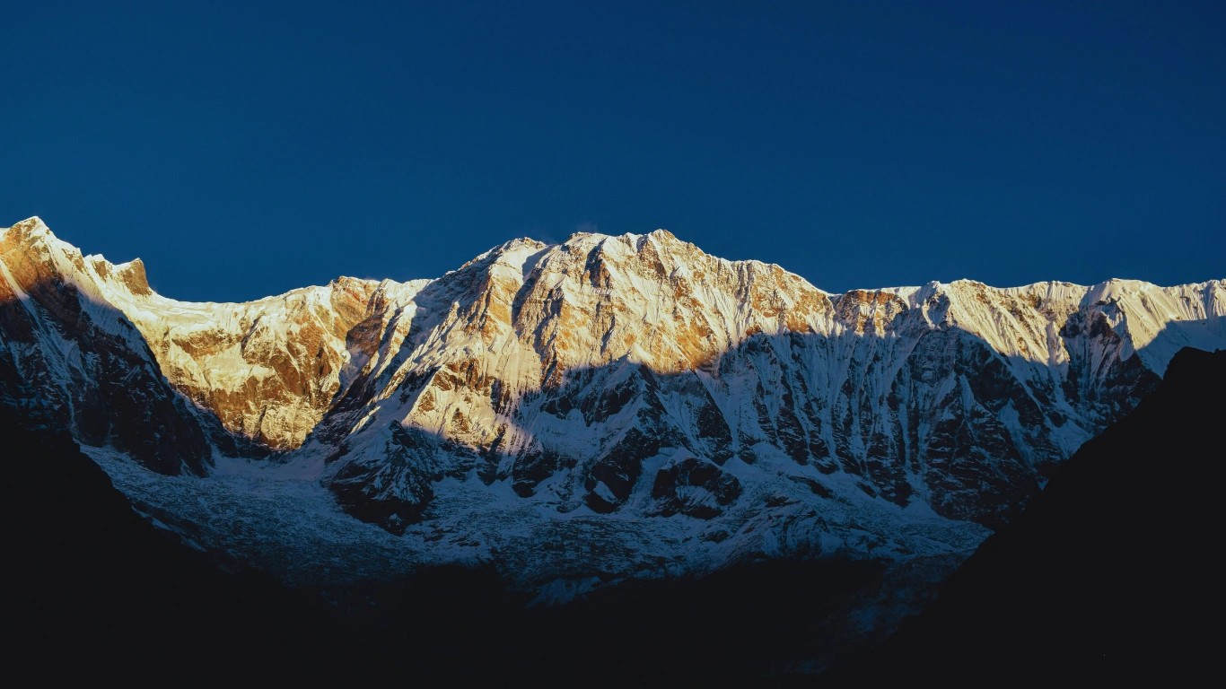 Annapurna I peak illuminated by morning light after sunrise at Annapurna Base Camp.