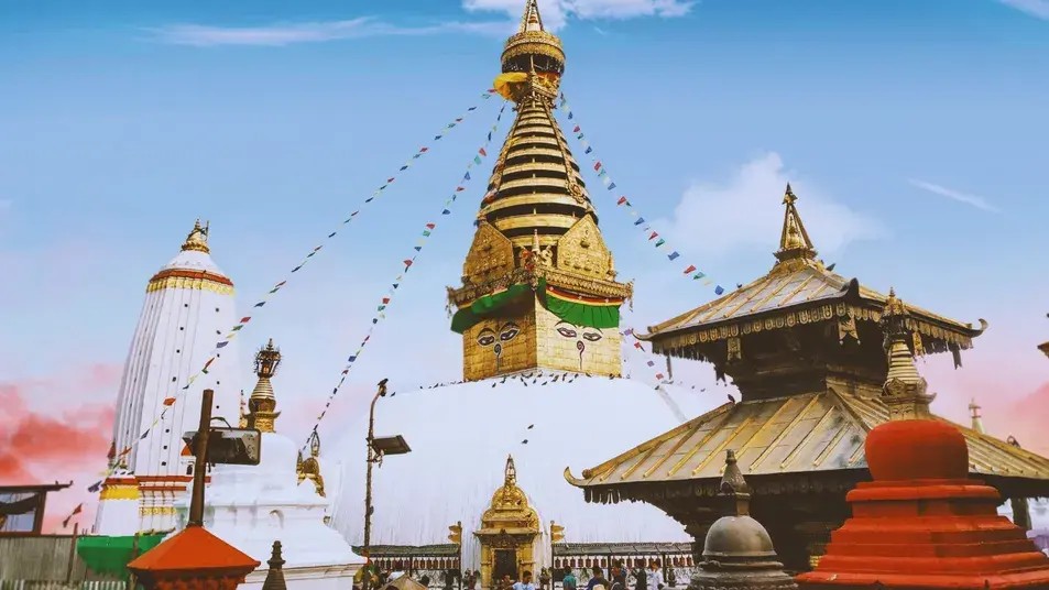 Close-up of Swayambhunath Monkey Temple in Kathmandu, Nepal, highlighting the stupa, prayer flags, and surrounding monkeys.