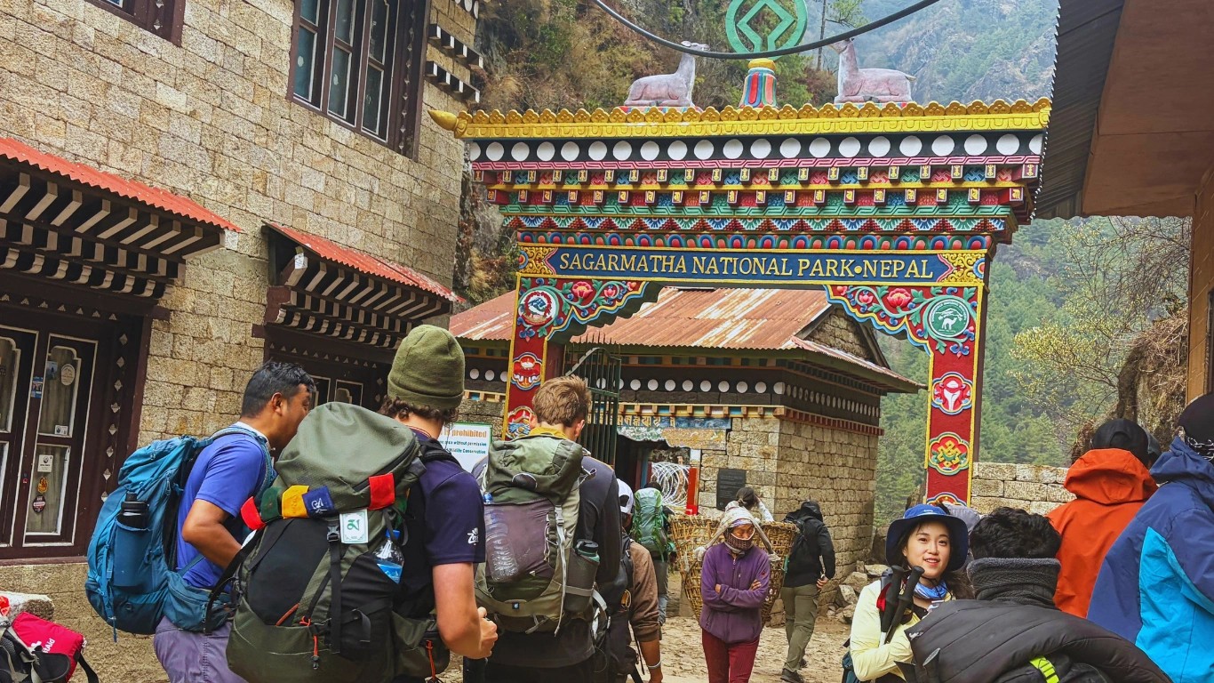 Sagarmatha National Park Jorsalle entrance gate with trekkers presenting permits, Solukhumbu Nepal