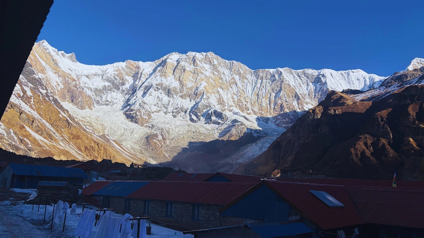 Teahouse on the Annapurna Base Camp Trek with Annapurna I visible towering in the background.