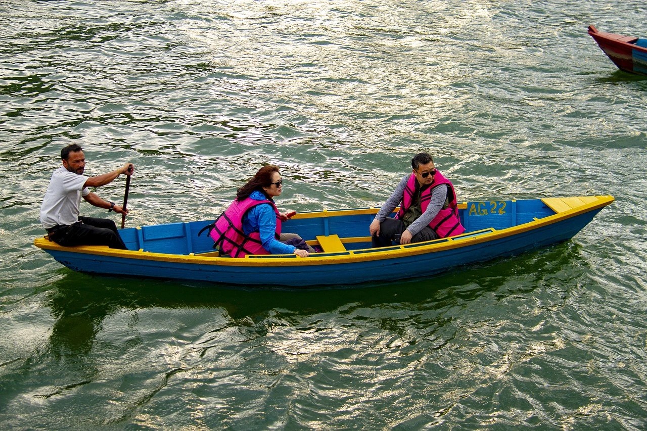 Couple enjoying a peaceful Boating in Phewa Lake in Pokhara, one of the most romantic places in Nepal.