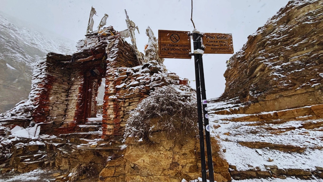 Phu village gate signboard showing 4,010 m altitude on Nar Phu Valley Trek