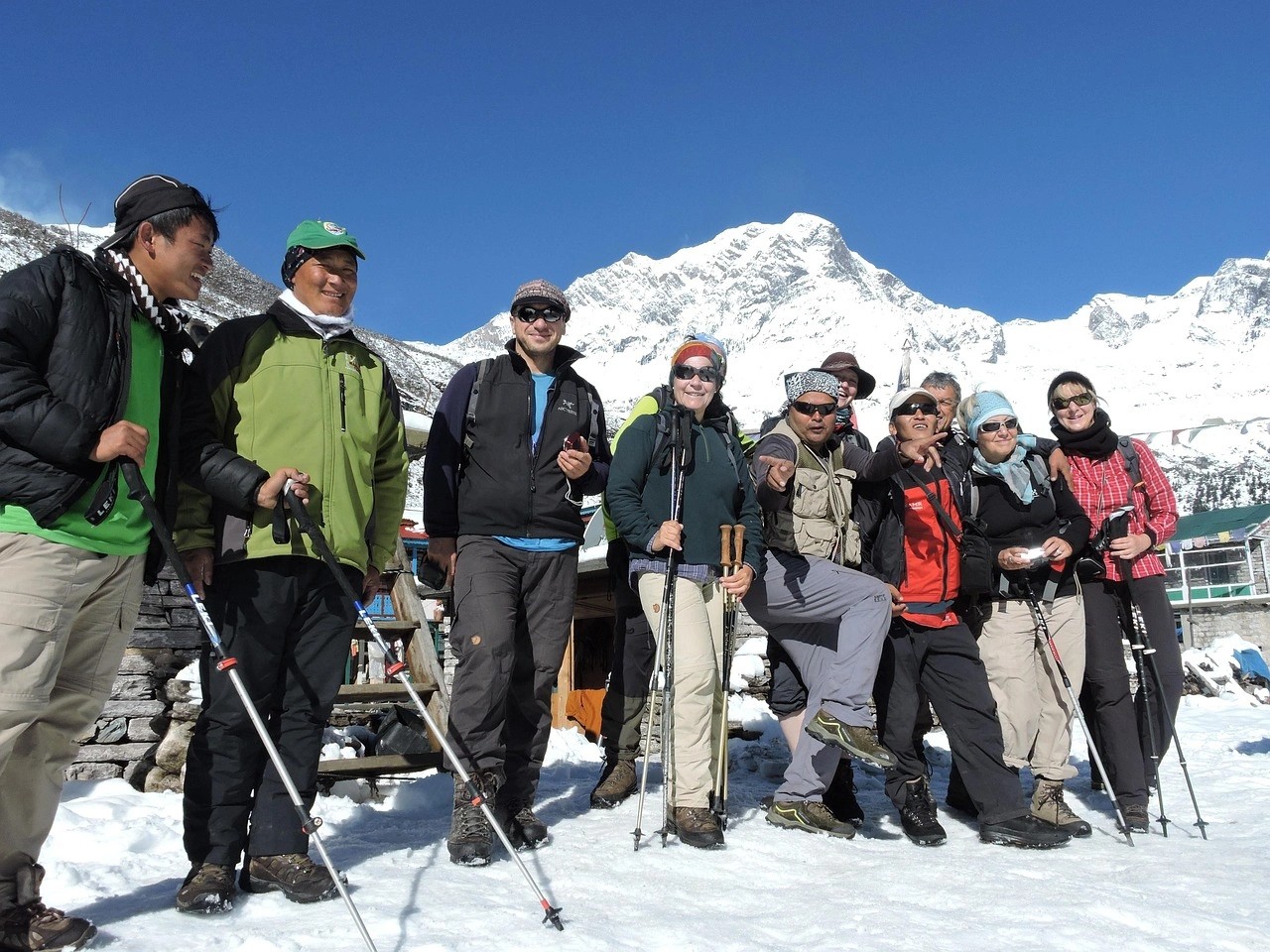 Group of trekkers enjoying the MCT Trek Nepal, smiling and taking in the Himalayan scenery