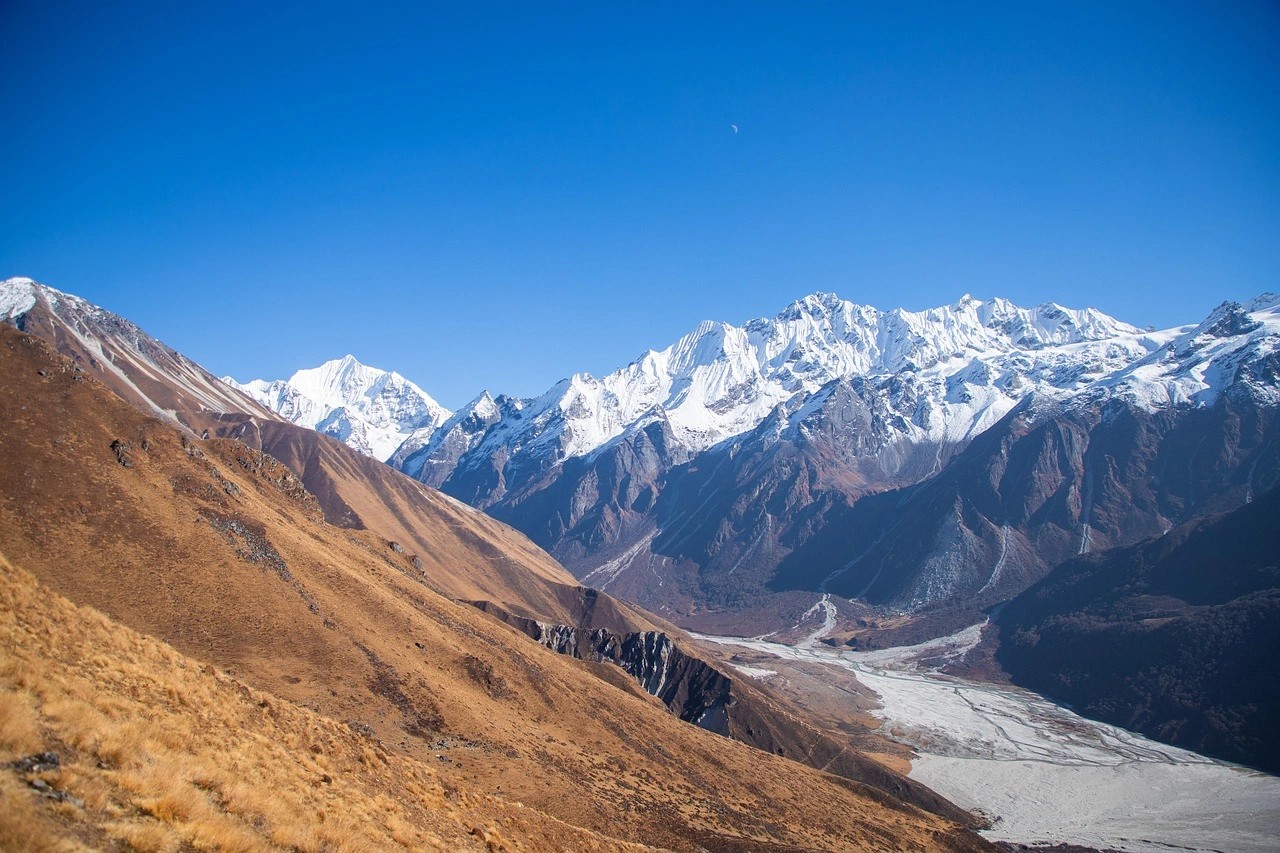 Panoramic view of Langtang Valley mountain ranges highlighting natural beauty and trekking appeal.