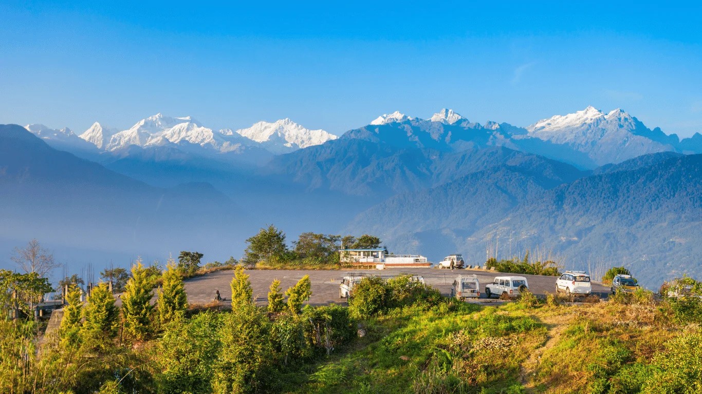 Mount Kanchenjunga rising above the Himalayan mountain range on the Nepal–India border, with snow-covered peaks surrounding its 8,586-meter summit.