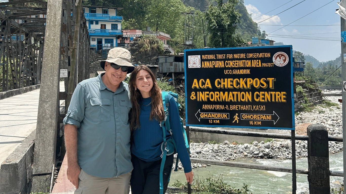 Father and daughter starting their trek from Banthati on the way to Annapurna Base Camp.