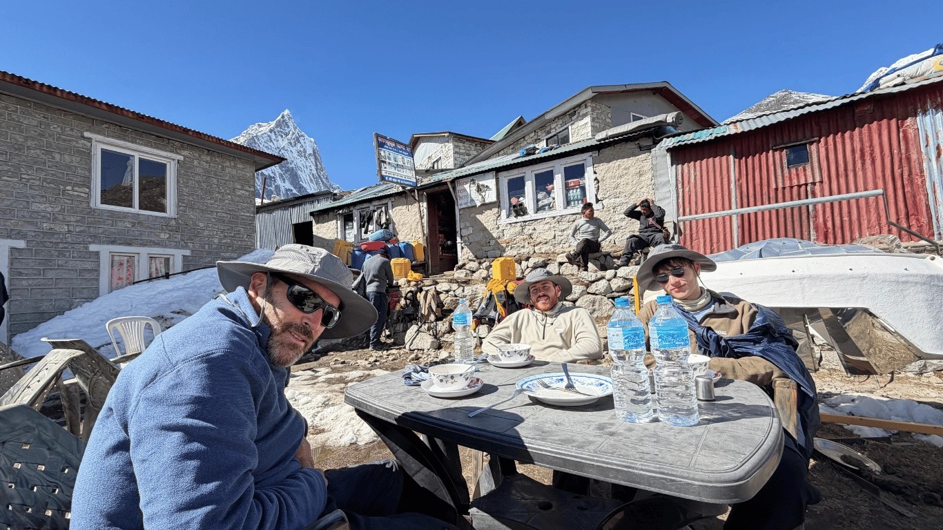 A guest drinks plenty of water and enjoys warm garlic soup as part of a careful approach to high-altitude acclimatization.