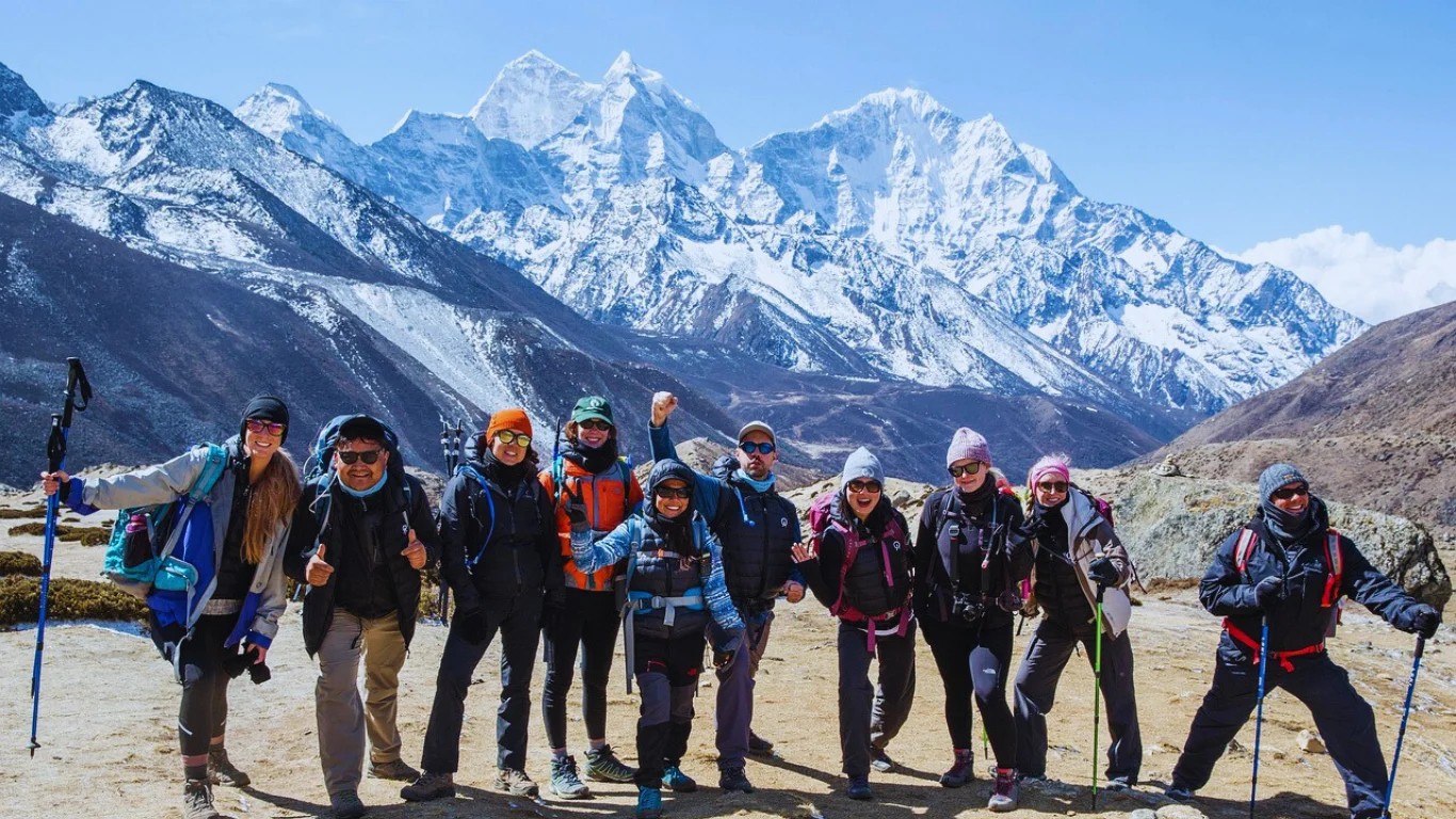 Group of trekkers at Everest Base Camp 5,364m with Mount Everest region glaciers on a best Nepal treks from Kathmandu adventure.