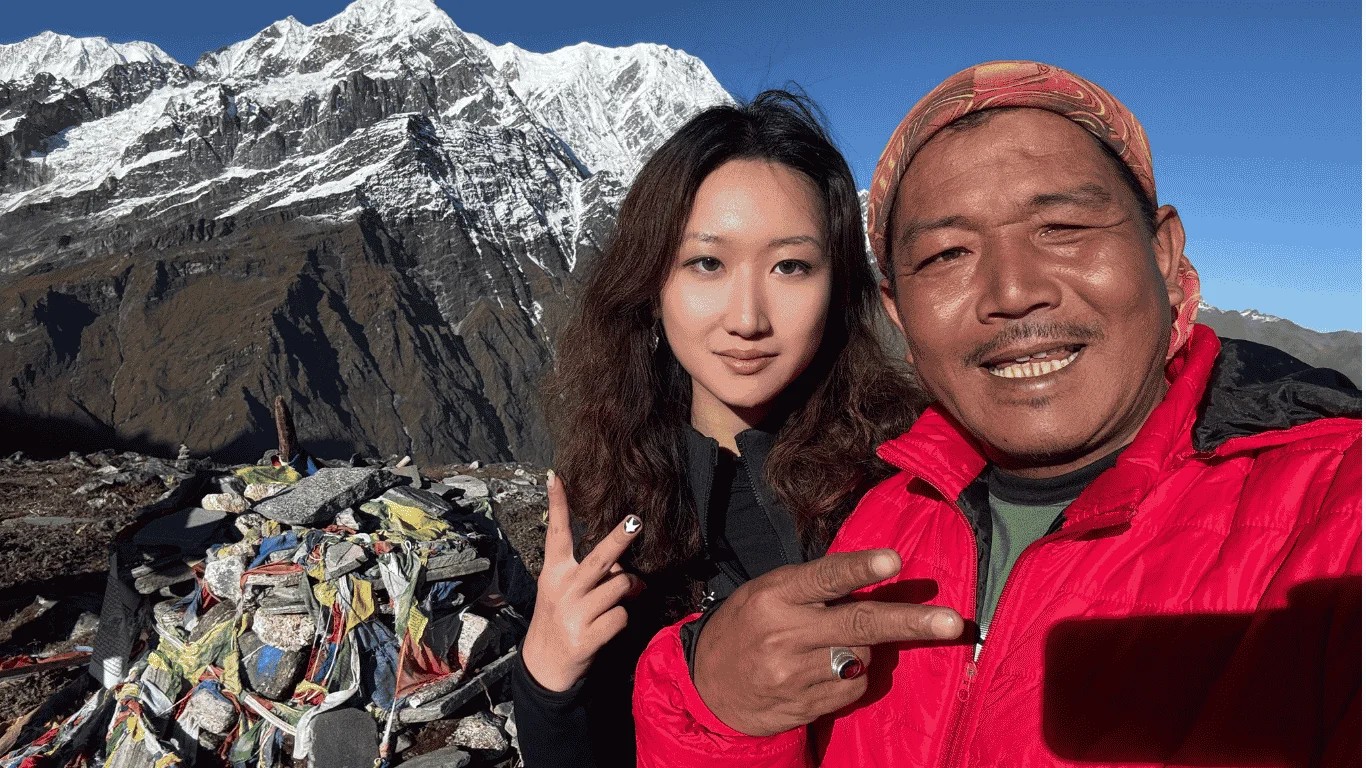 A proud moment at Mardi Himal Base Camp with our local guide and guest, surrounded by the spectacular peaks of the Annapurna region.