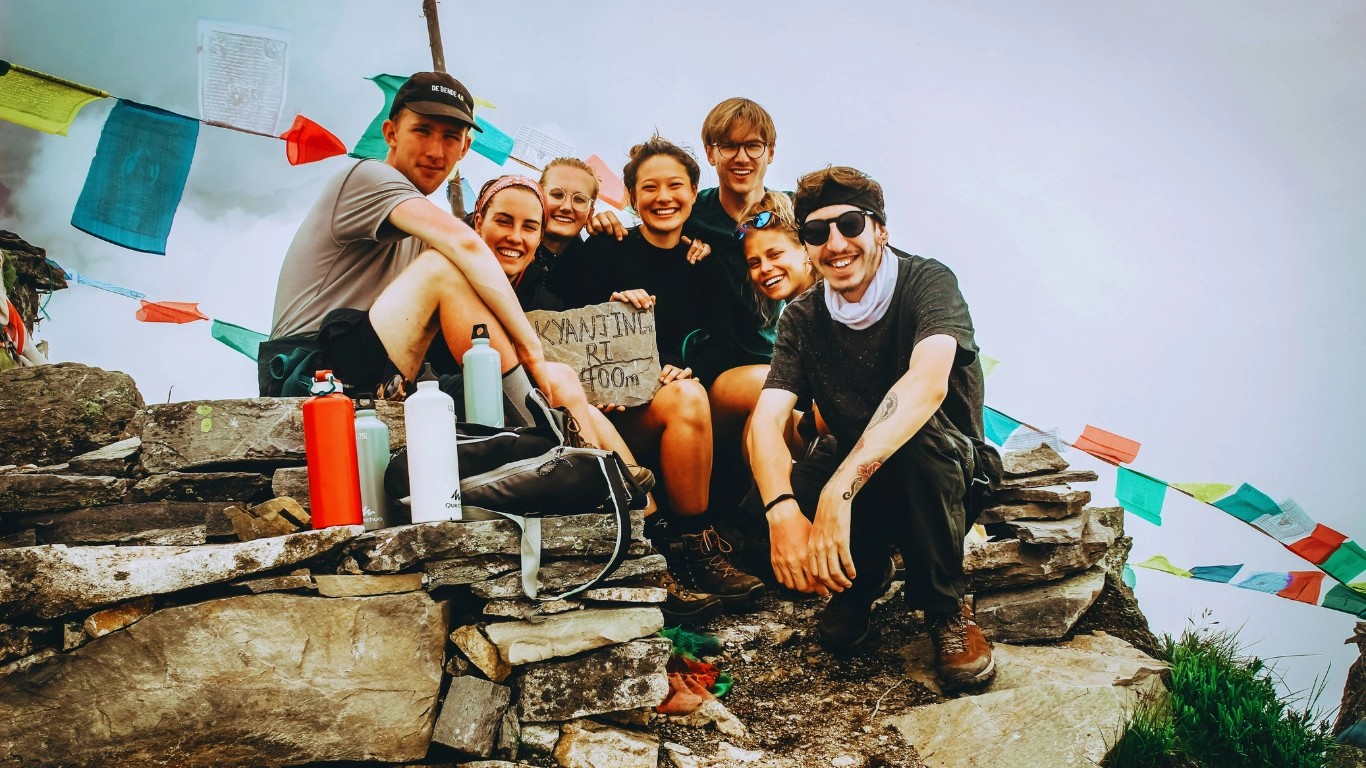 Happy trekkers smiling at Kyajin Ri during acclimatization on the Langtang Valley Trek.