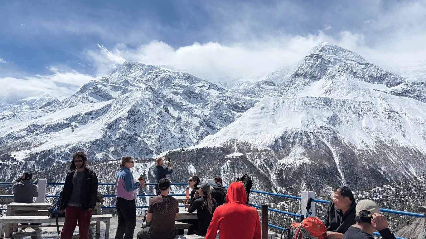 Independent trekkers walking the Annapurna Circuit trail in Nepal without a guide during the October 2026 trekking season.
