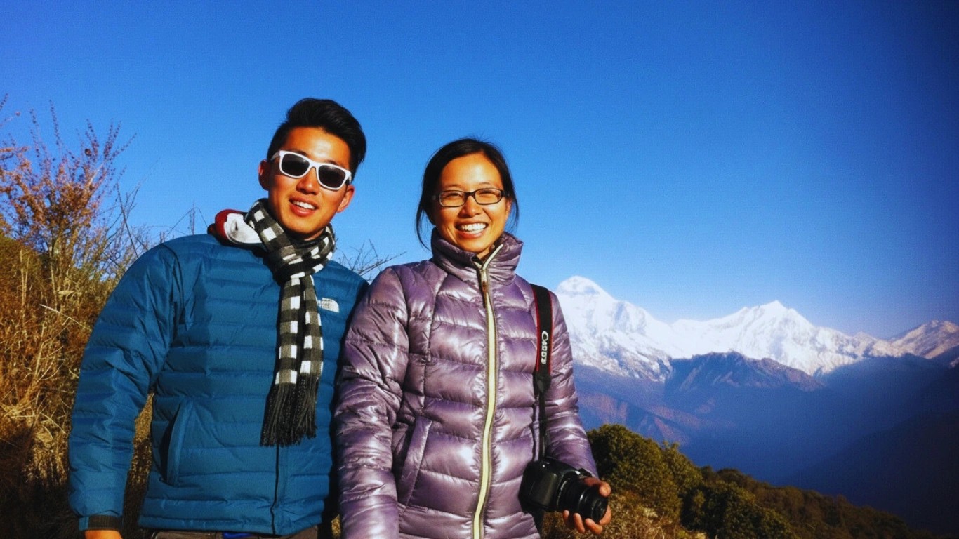 Couple with Himalayan mountains in the background at a romantic place in Nepal.