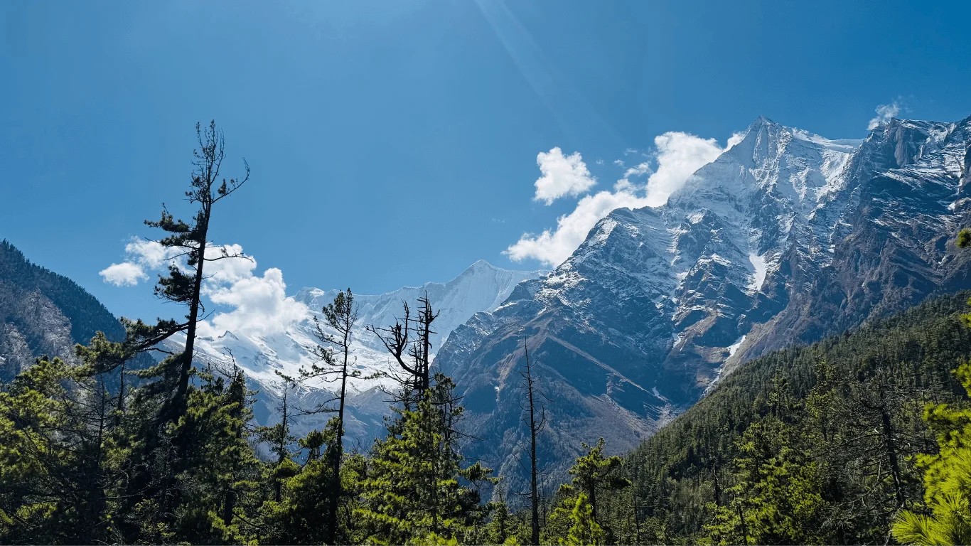 Annapurna II and Annapurna IV mountain views from the upper trekking route between Upper Pisang and Ghyaru on the Annapurna Circuit in Nepal.