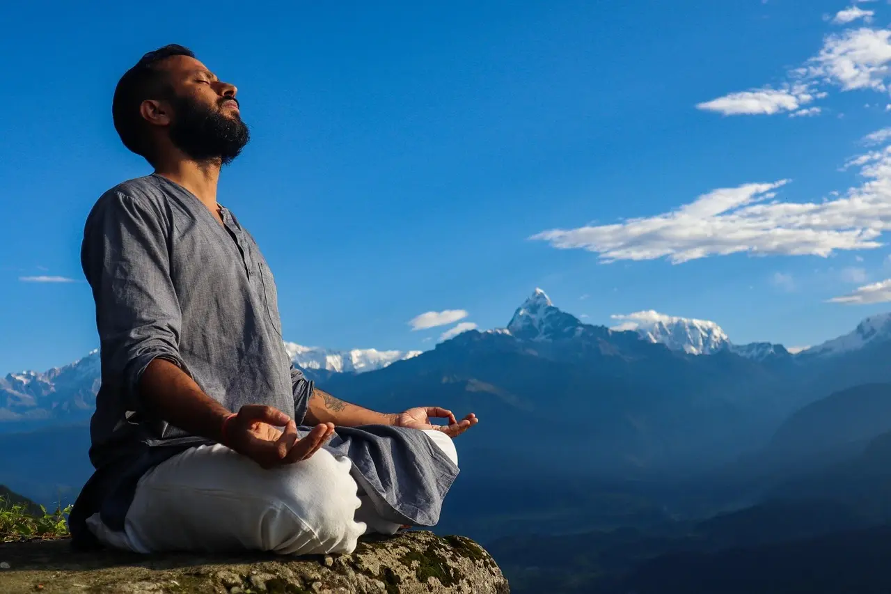 Sunrise meditation during Poon Hill yoga trek in Nepal with Annapurna mountain views