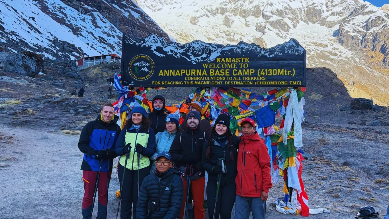 Annapurna Base Camp Express Trek with trekkers enjoying panoramic Himalayan views at Annapurna Base Camp in Nepal.