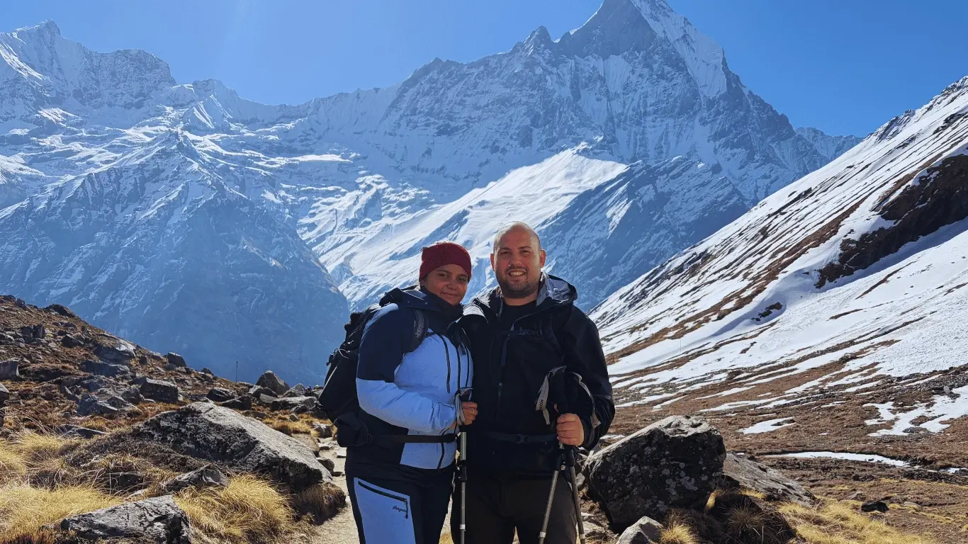Annapurna Base Camp Express Trek with trekkers enjoying panoramic Himalayan views at Annapurna Base Camp in Nepal.